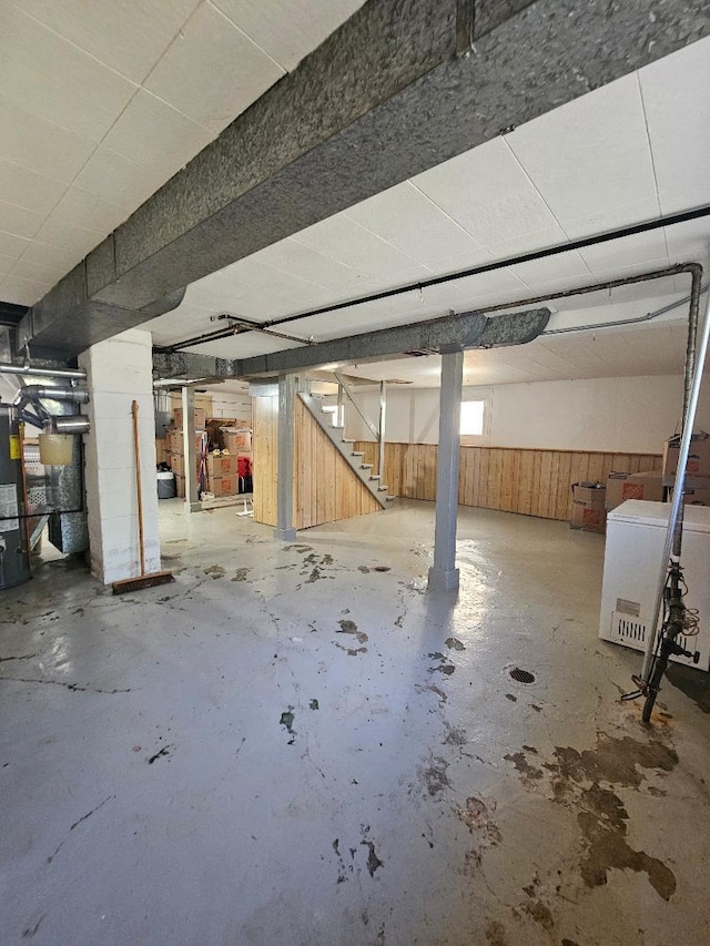 5626 N Mcvicker Ave, Chicago, IL 60646 - below grade area featuring stairs, washer / clothes dryer, wooden walls, and water heater