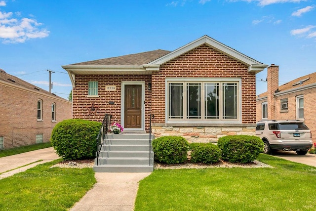 11334 S Central Park Ave, Chicago, IL 60655 - bungalow with a front yard and brick siding