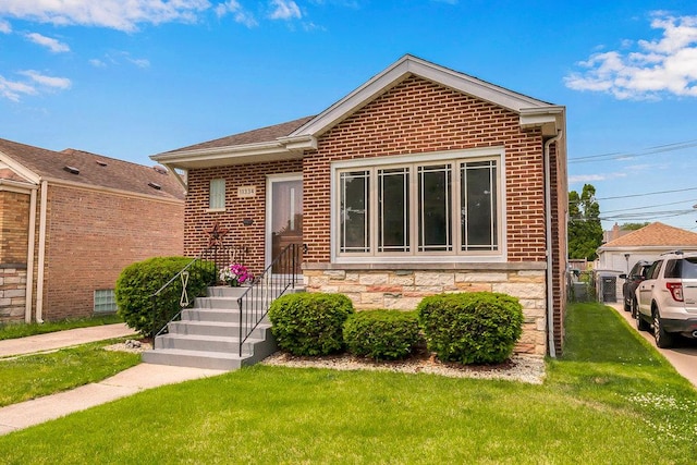 11334 S Central Park Ave, Chicago, IL 60655 - bungalow-style home featuring a front lawn, brick siding, and stone siding