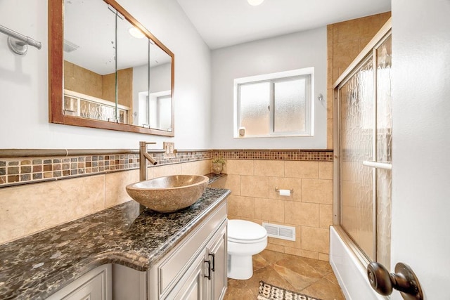 11334 S Central Park Ave, Chicago, IL 60655 - bathroom with vanity, tile walls, tile patterned floors, bath / shower combo with glass door, and wainscoting
