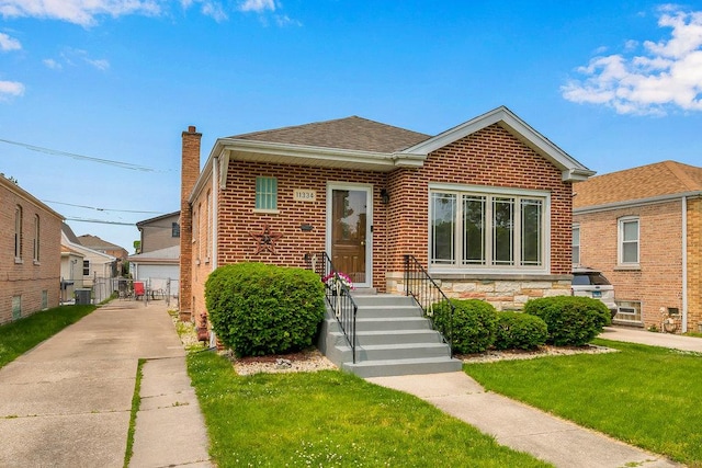 11334 S Central Park Ave, Chicago, IL 60655 - bungalow-style house with brick siding, a chimney, and roof with shingles