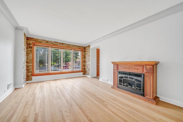 11334 S Central Park Ave, Chicago, IL 60655 - unfurnished living room with light wood-type flooring and a fireplace with raised hearth