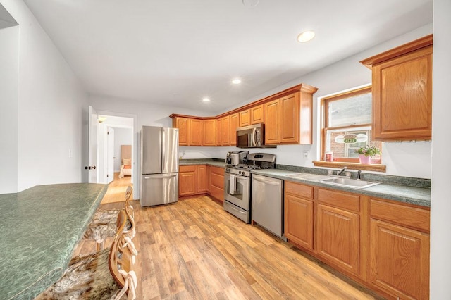 11334 S Central Park Ave, Chicago, IL 60655 - kitchen featuring appliances with stainless steel finishes, light wood-style floors, dark countertops, recessed lighting, and brown cabinets