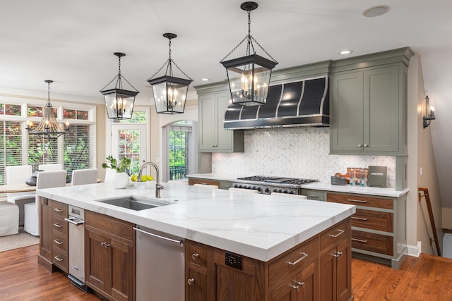 1046 Sylvan Cir, Naperville, IL 60540 - kitchen with wall chimney range hood, a chandelier, decorative backsplash, dark wood-type flooring, and hanging light fixtures