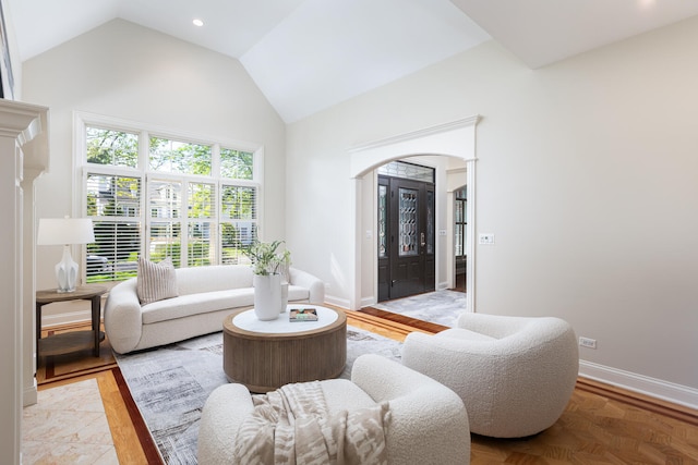 1046 Sylvan Cir, Naperville, IL 60540 - living room with arched walkways, high vaulted ceiling, and recessed lighting