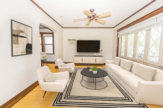 3110 N 78th Ave, Elmwood Park, IL 60707 - living room featuring arched walkways, crown molding, light wood-type flooring, and a ceiling fan