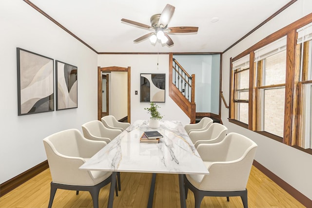 3110 N 78th Ave, Elmwood Park, IL 60707 - dining area with a ceiling fan, light wood-style floors, stairway, and crown molding