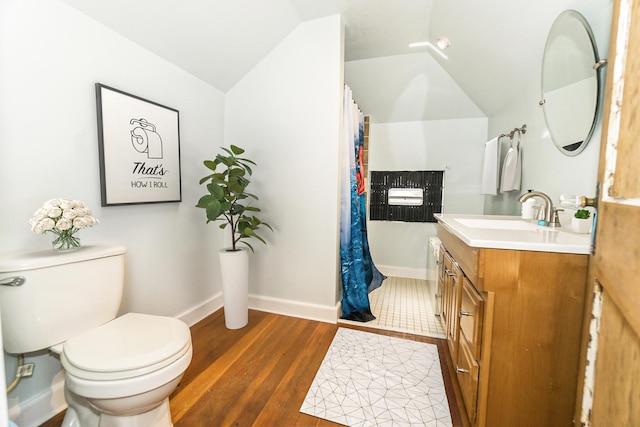3110 N 78th Ave, Elmwood Park, IL 60707 - bathroom featuring vanity, vaulted ceiling, wood finished floors, and curtained shower