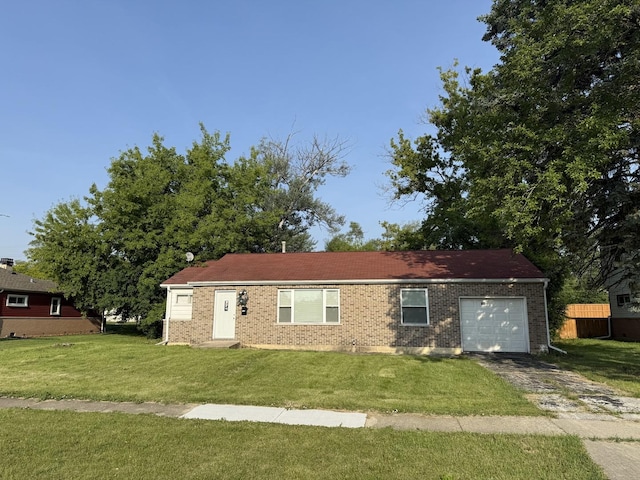 700 Cumberland St, Hoffman Estates, IL 60194 - view of front facade with a garage, driveway, a front yard, and brick siding
