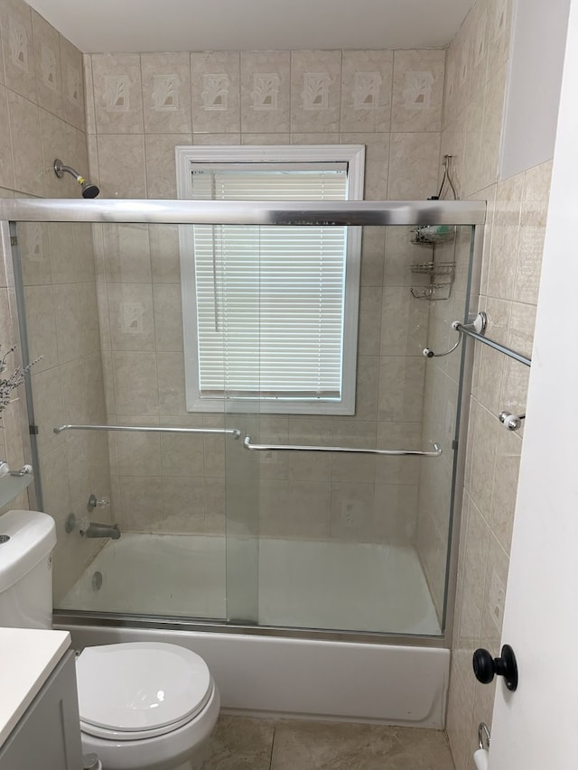 700 Cumberland St, Hoffman Estates, IL 60194 - bathroom featuring vanity, shower / bath combination with glass door, and tile patterned floors
