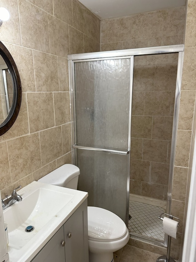 700 Cumberland St, Hoffman Estates, IL 60194 - full bath with a stall shower, vanity, tile patterned floors, and tile walls