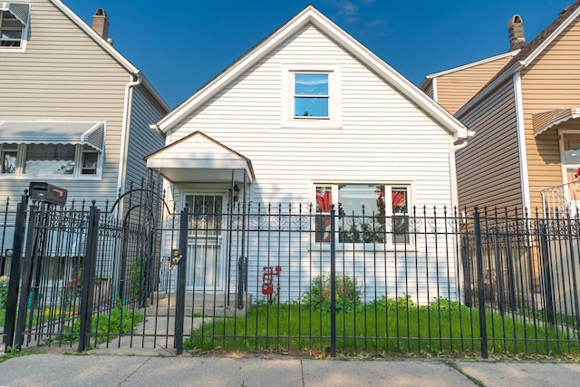 2103 N Long Ave, Chicago, IL 60639 - view of front of property with a fenced front yard and a gate