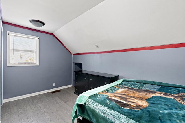 2103 N Long Ave, Chicago, IL 60639 - bedroom with wood finished floors and lofted ceiling