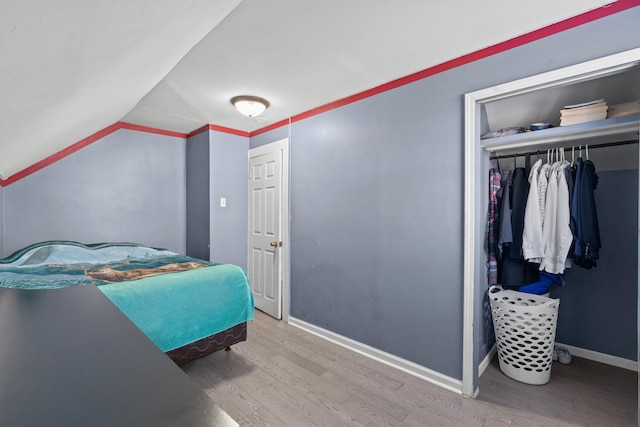 2103 N Long Ave, Chicago, IL 60639 - bedroom featuring wood finished floors, lofted ceiling, and a closet