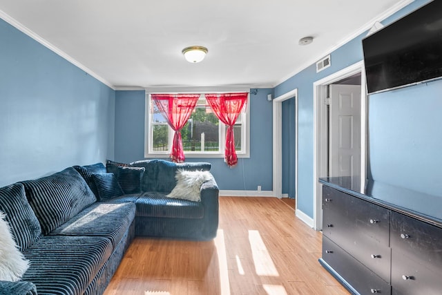 2103 N Long Ave, Chicago, IL 60639 - living room with light wood-type flooring and ornamental molding