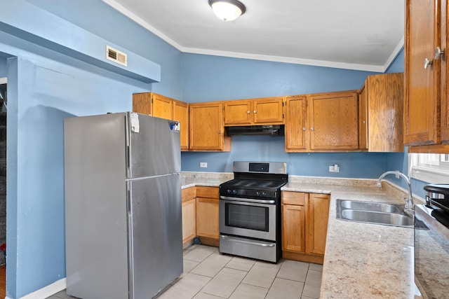 2103 N Long Ave, Chicago, IL 60639 - kitchen with stainless steel appliances, under cabinet range hood, lofted ceiling, light countertops, and brown cabinetry