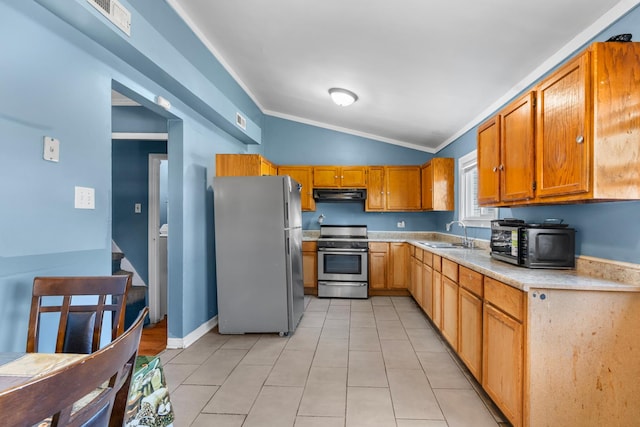 2103 N Long Ave, Chicago, IL 60639 - kitchen with stainless steel appliances, vaulted ceiling, extractor fan, crown molding, and light countertops