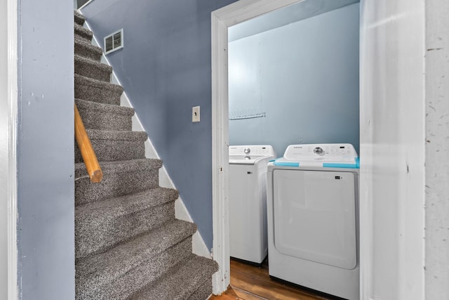 2103 N Long Ave, Chicago, IL 60639 - laundry room featuring separate washer and dryer and wood finished floors