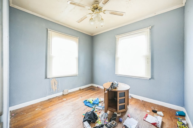 230 W Garfiled Ave, Decatur, IL 62526 - spare room featuring crown molding, wood-type flooring, and a ceiling fan