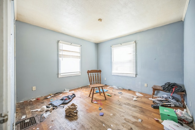 230 W Garfiled Ave, Decatur, IL 62526 - empty room with hardwood / wood-style floors and a textured ceiling