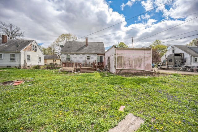 230 W Garfiled Ave, Decatur, IL 62526 - rear view of property featuring a wooden deck and an outbuilding