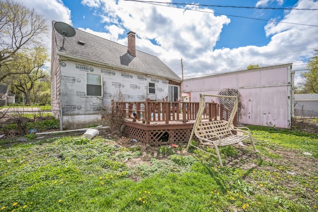 230 W Garfiled Ave, Decatur, IL 62526 - back of property featuring a deck, a chimney, and a shingled roof
