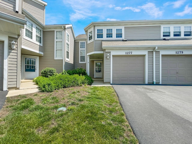 1277 Donegal Ct, Carol Stream, IL 60188 - townhome / multi-family property featuring driveway and an attached garage
