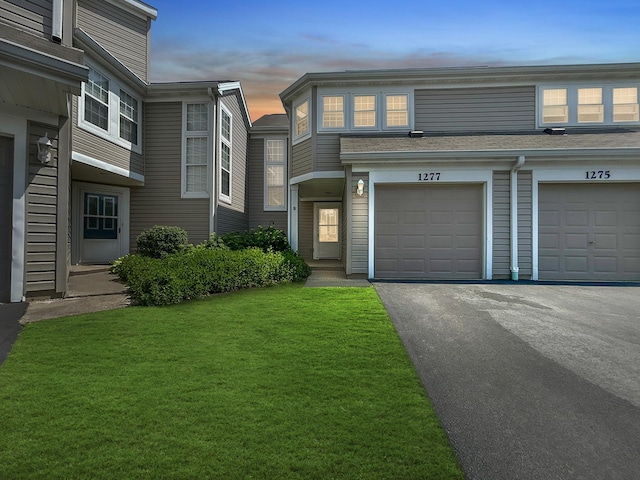 1277 Donegal Ct, Carol Stream, IL 60188 - townhome / multi-family property featuring a front lawn, driveway, and a garage
