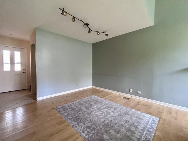 1277 Donegal Ct, Carol Stream, IL 60188 - empty room featuring wood finished floors and rail lighting