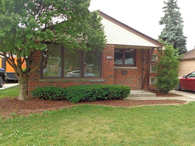 5157 W 90th St, Oak Lawn, IL 60453 - view of front facade with brick siding and a front lawn