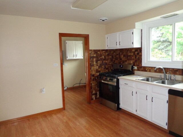5157 W 90th St, Oak Lawn, IL 60453 - kitchen with appliances with stainless steel finishes, backsplash, white cabinets, and light wood-type flooring