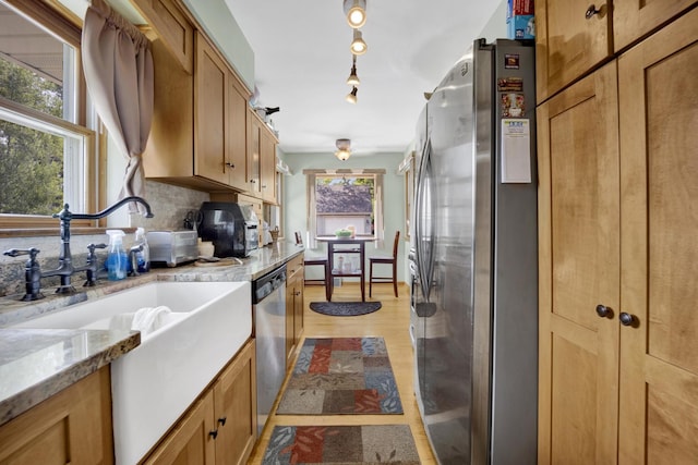 648 S Illinois Ave, Villa Park, IL 60181 - kitchen with stainless steel appliances, brown cabinetry, tasteful backsplash, light wood-type flooring, and light stone counters