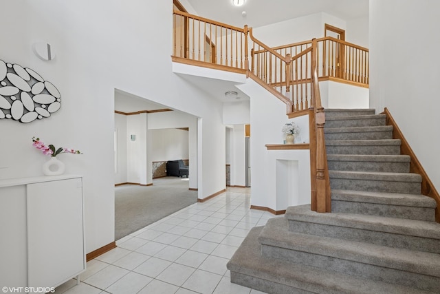 1456 Della Dr, Hoffman Estates, IL 60169 - stairs featuring carpet floors, a high ceiling, and tile patterned floors