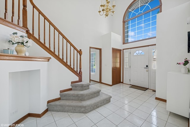 1456 Della Dr, Hoffman Estates, IL 60169 - tiled entryway featuring stairs, a high ceiling, healthy amount of natural light, and baseboards