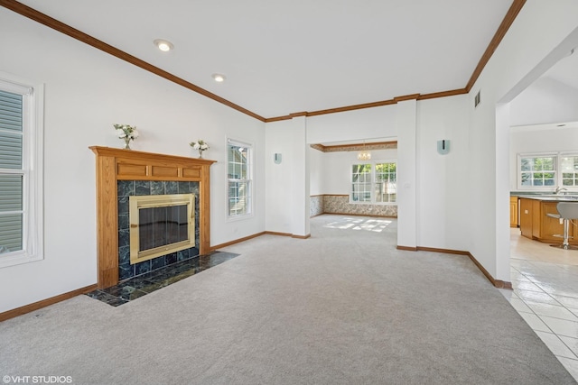 1456 Della Dr, Hoffman Estates, IL 60169 - unfurnished living room featuring carpet, ornamental molding, a high end fireplace, healthy amount of natural light, and tile patterned flooring