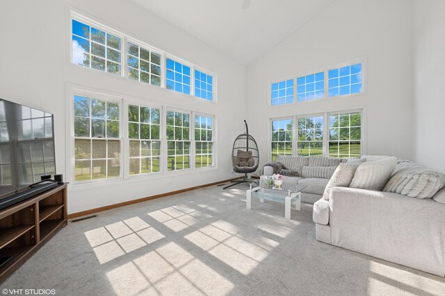 1456 Della Dr, Hoffman Estates, IL 60169 - carpeted living area featuring high vaulted ceiling and baseboards