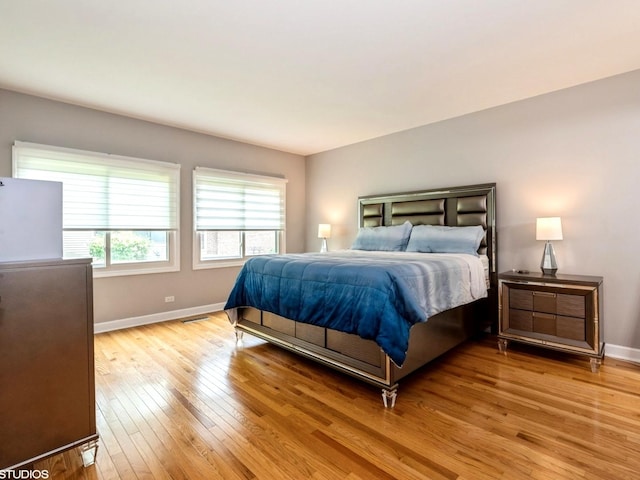 1022 Pinetree Cir N Unit 1022, Buffalo Grove, IL 60089 - bedroom featuring light wood-style floors and baseboards