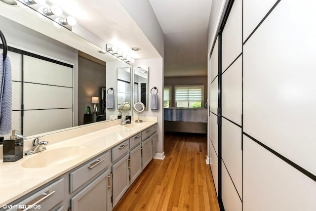 1022 Pinetree Cir N Unit 1022, Buffalo Grove, IL 60089 - ensuite bathroom featuring double vanity and wood finished floors