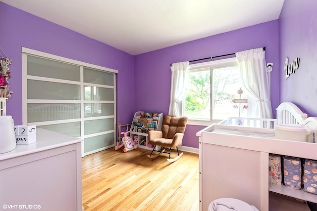 1022 Pinetree Cir N Unit 1022, Buffalo Grove, IL 60089 - bedroom with light wood-style flooring and baseboards