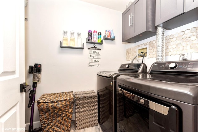 1022 Pinetree Cir N Unit 1022, Buffalo Grove, IL 60089 - washroom featuring cabinet space and washer and clothes dryer