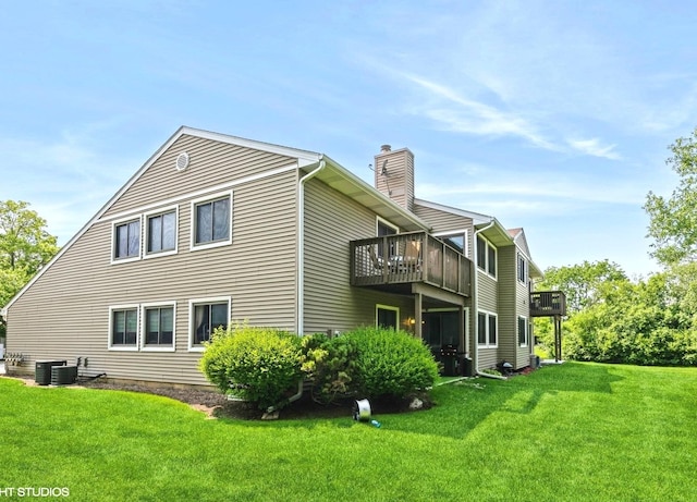 1022 Pinetree Cir N Unit 1022, Buffalo Grove, IL 60089 - view of property exterior featuring a chimney, a lawn, and a wooden deck