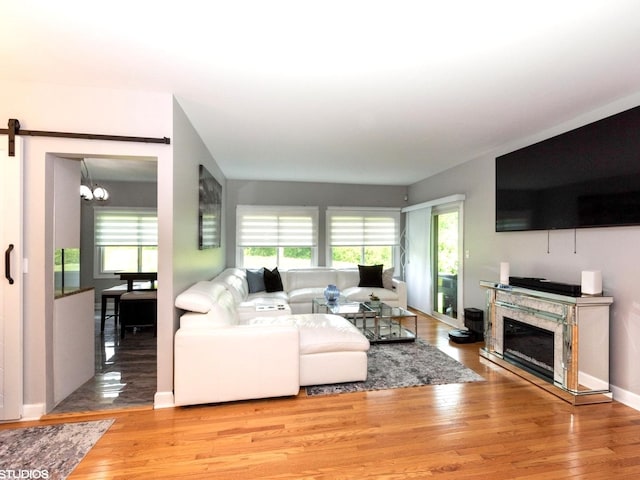 1022 Pinetree Cir N Unit 1022, Buffalo Grove, IL 60089 - living area with wood finished floors, a chandelier, and a premium fireplace