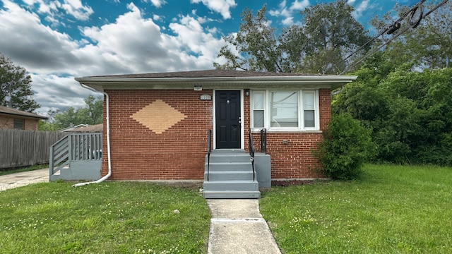 105 W 158th Pl, Harvey, IL 60426 - bungalow-style home featuring brick siding