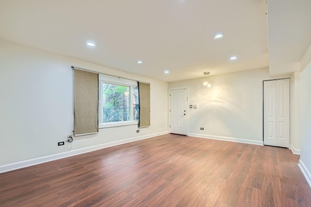 2067 W Farwell Ave Unit 1S, Chicago, IL 60645 - spare room featuring wood finished floors and recessed lighting