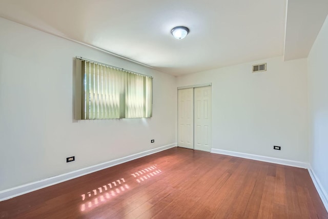 2067 W Farwell Ave Unit 1S, Chicago, IL 60645 - unfurnished room with hardwood / wood-style floors and baseboards