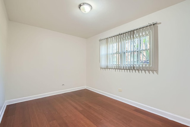 2067 W Farwell Ave Unit 1S, Chicago, IL 60645 - empty room featuring baseboards and dark wood finished floors