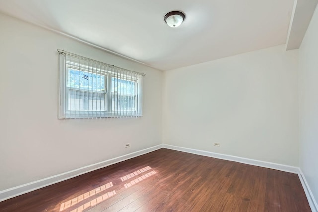 2067 W Farwell Ave Unit 1S, Chicago, IL 60645 - spare room featuring dark wood finished floors and baseboards