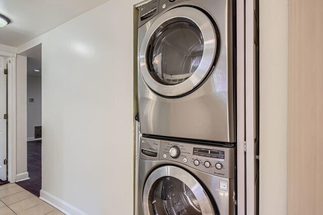 2067 W Farwell Ave Unit 1S, Chicago, IL 60645 - laundry room with stacked washer / drying machine and light tile patterned floors