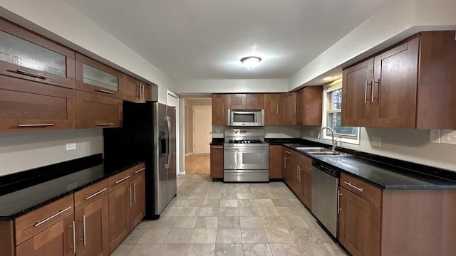 1607 Sylvan Ct, Flossmoor, IL 60422 - kitchen with appliances with stainless steel finishes, dark stone countertops, and glass insert cabinets