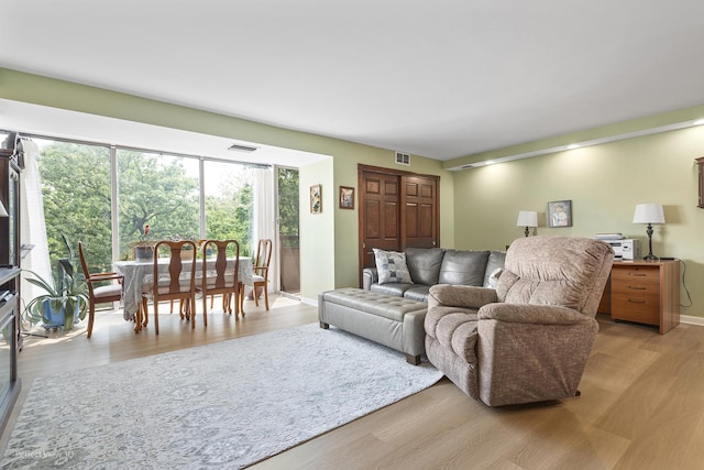 1301 N Western Ave Unit 317, Lake Forest, IL 60045 - living area with light wood-style flooring and baseboards